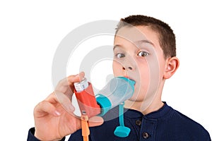 Kid using Inhaler with Spacer photo