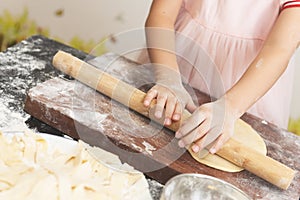 Kid using stick to make noodles