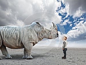 Kid vs rhino photo