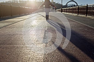 Kid walking away across a bridge in winter day, forward to the future, planning and goals