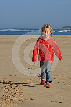 Kid walking on the beach