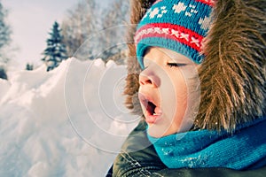 Kid want to sneeze. Snow winter.