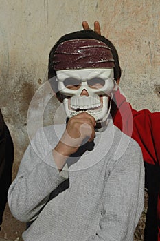 Kid wearing sceleton mask