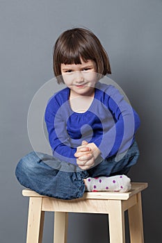 Kid wellbeing concept for smiling preschool child relaxing