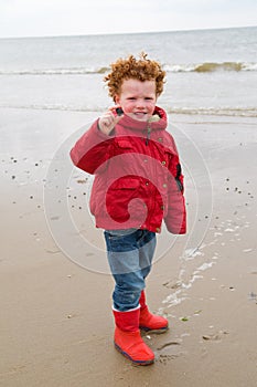 Kid at winter beach