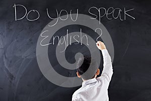 Kid writes text of Do You Speak English