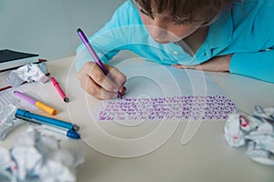 Kid writing and learning numbers, doing math homework