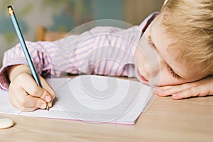 Kid writing in notebook