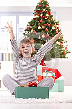 Kid yelling happily at christmas gift