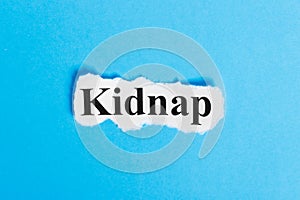 Kidnap text on paper. Word Kidnap on a piece of paper. Concept Image photo