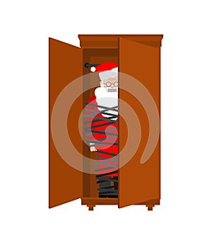 Kidnapped Santa Claus. Grandfather tied with rope. Santa was hidden in the closet. There will be no christmas