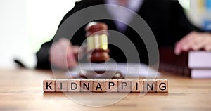 Kidnapping text and judge knocking gavel in court