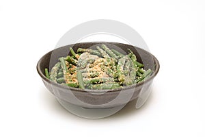 Kidney beans with grind sesame dressing in the bowl isolted on a white background
