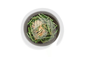 Kidney beans with grind sesame dressing in the bowl isolted on a white background