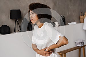 Kidney infection pyelonephritis urinary tract infection. African american woman feel backache spine pain because of UTI