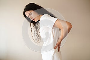 Kidney infection pyelonephritis urinary tract infection. Attractive woman feel backache spine pain because of UTI
