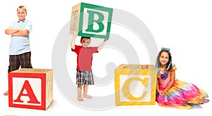 Kids with ABC in Alphabet Blocks