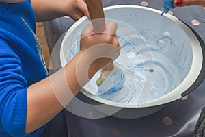 Kids activity of making slime as a science experiment for children to do indoors