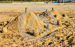 Kids and adult creativity, Sand castles on the beach, summer season background