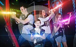 Kids and adults in beams on lasertag arena