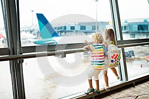 Kids travel and fly. Child at airplane in airport