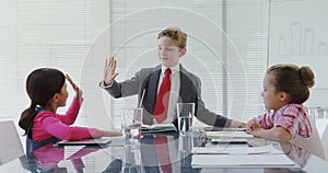 Kids as business executives having a meeting in the board room 4K 4k