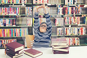 Kids asia boy reading books for education and go to school in library