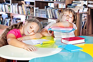 Kids asleep in a library photo