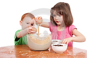 Kids baking chocolate chip cookies