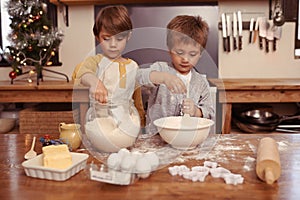 Kids, baking and playing in home with flour, love and bonding with ingredients for dessert cake. Boys, mixing or bowl