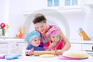 Kids baking in a white kitchen