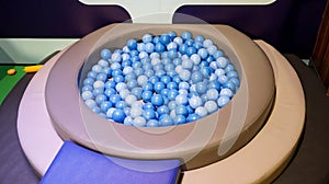 Kids ball pool full of blue and white plastic ball for indoor kids activities