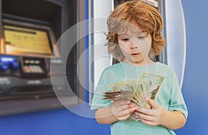 Kids banking and Finance. Piggy bank investments. Saving money. Child with dollars.