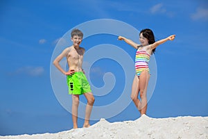Kids in bathing suits on beach