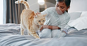 Kids, bedroom and a girl petting her cat in the morning for bonding in a home with love, trust or care. Children, bed