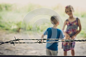 Kids behind the fence in Banstead woods