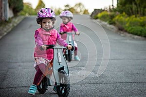 Kids on bicycle in sunny park