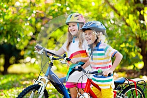 Kids on bike. Children on bicycle. Child biking