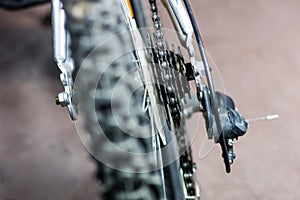 Kids bike. Shock absorber, brake, wheel shown close up.