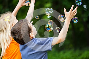 Kids blowing bubbles