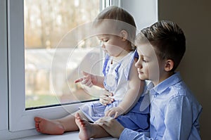 Kids in blue. Blue style.  Kid play indoor. A brother and sister love , toghever as friends