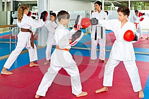 Kids boxing in gym, karate training