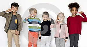 Kids brushing their teeth isolated on white background