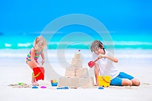 Kids building sand castle on the beach