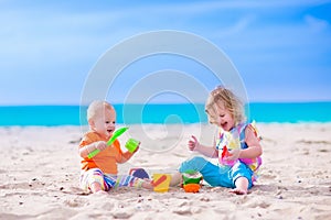 Kids building a sand castle on a beach