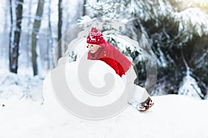 Kids building snowman. Children in snow. Winter fun.