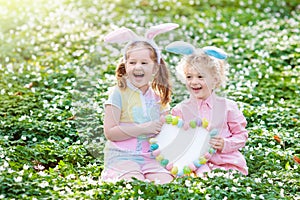 Kids with bunny ears on Easter egg hunt.