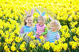 Kids with bunny ears on Easter egg hunt