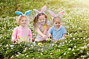 Kids with bunny ears on Easter egg hunt