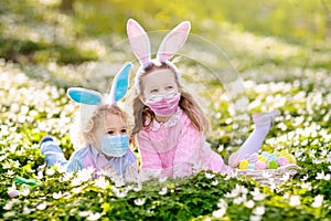 Kids with bunny ears on Easter egg hunt